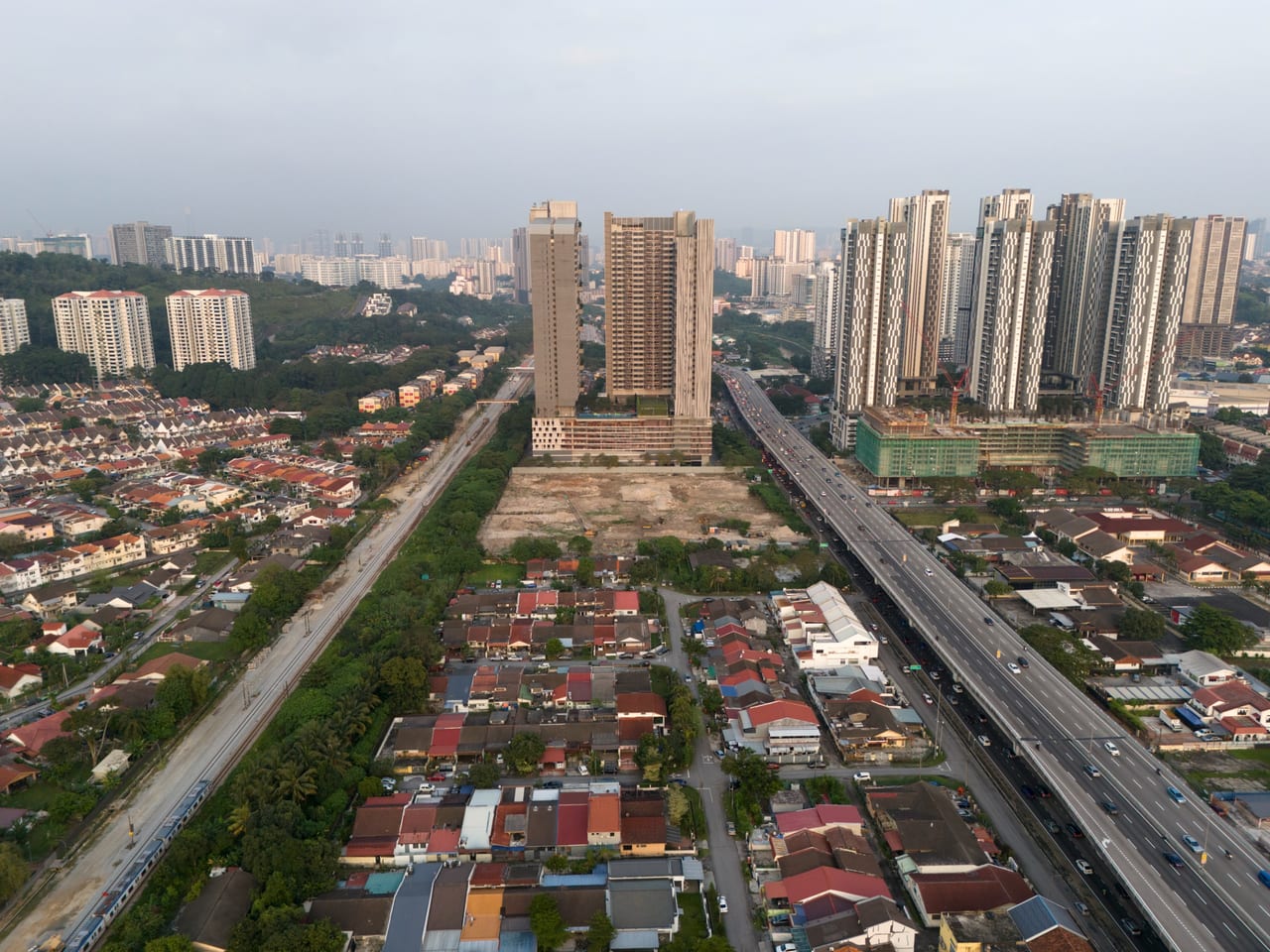 Old Klang Road by day — the corridor between the KTM rail line and the highway